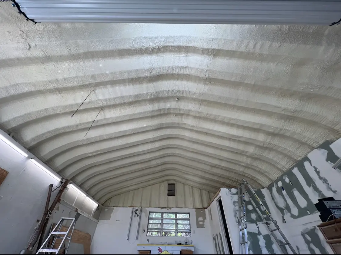 Spray polyurethane foam applied to the underside of a metal roof deck in Plaistow